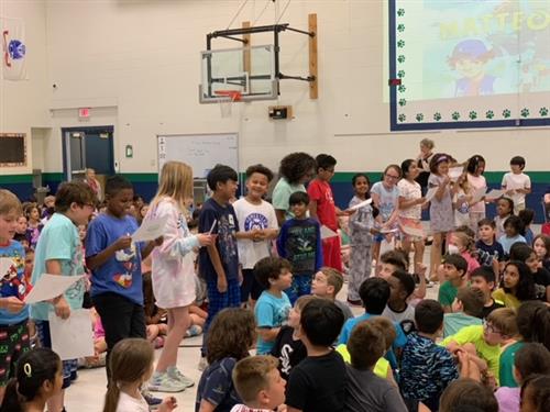 3rd grade students reading  a letter to Michael Leali