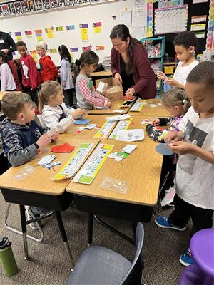 Mrs. Lowe's class doing crafts at the winter party