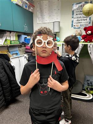 Mrs. Jordan's student using props at the winter party
