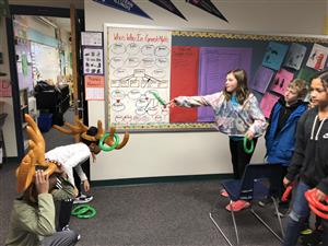 Mrs. Curran's class playing games at the winter party
