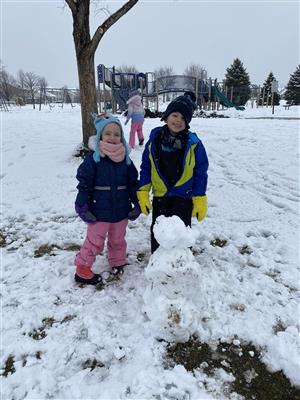 Kindergarten students making a snowman
