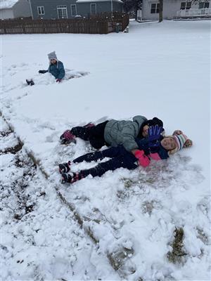 Kindergarten students playing in the snow