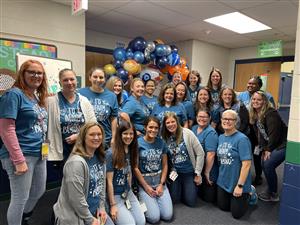 Students making a snowman
