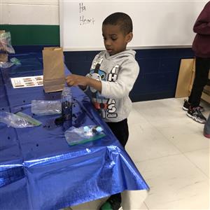 STARS student making a craft 