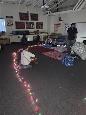 STARS students and families listening to music