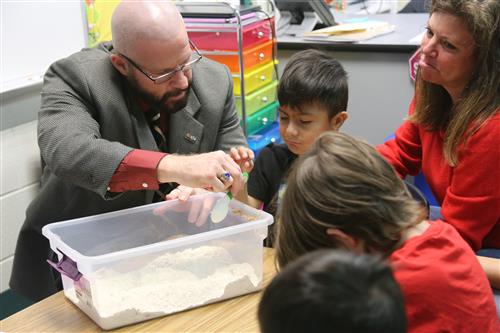 Dr. Sparlin with student mixing mixture