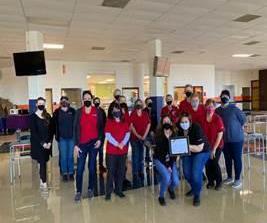 Team of food staff members in a cafe. 