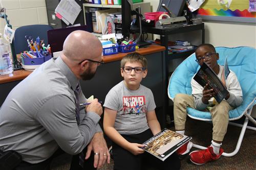 Dr. Sparlin with 2 students