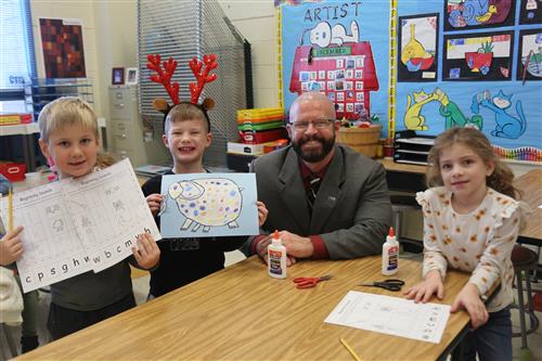 Dr. Sparlin with students in art class