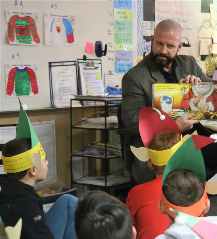 Dr. Sparlin reading to students