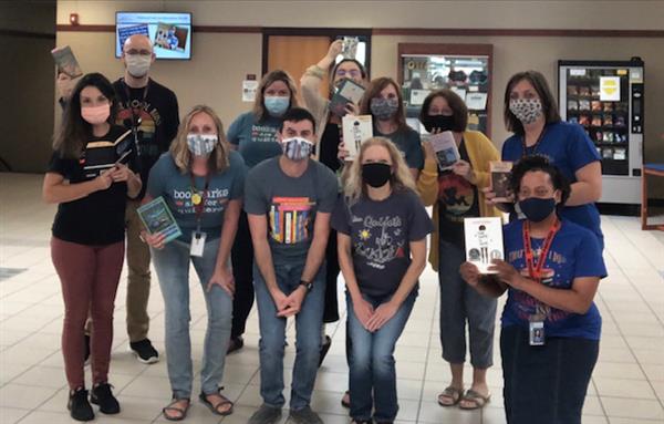 The English Department celebrated Banned Book Week by highlighting the importance of intellectual freedom and freedom to read.  Pictured here, team members wear book-related shirts and hold books that have (at one point) been challenged or banned.