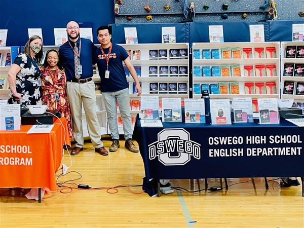 Teachers Ewa Tulak, Nicole Crocker, Ben Spears, and Iram Herrera work the August 2022 book fair, sponsored by Anderson Bookstore.