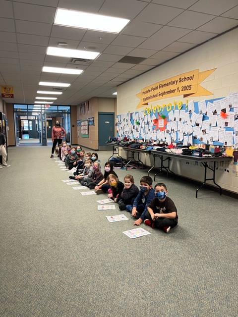 Mrs. Grauer's Kindergarten class stopped by to read to the office.