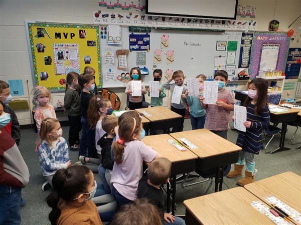 Mrs. Grauer's class sharing their writing with Ms. Gbur's class