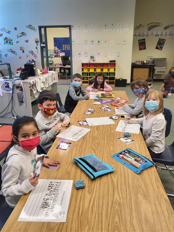 Mrs. Tellone's kindergarten class in in small groups for ELA