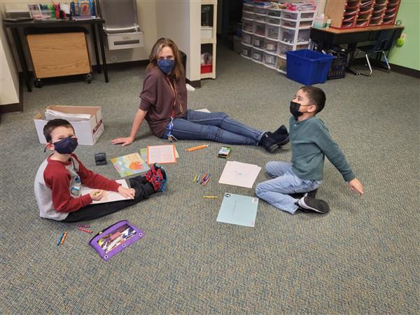 Mrs. Tellone's kindergarten class in in small groups for ELA