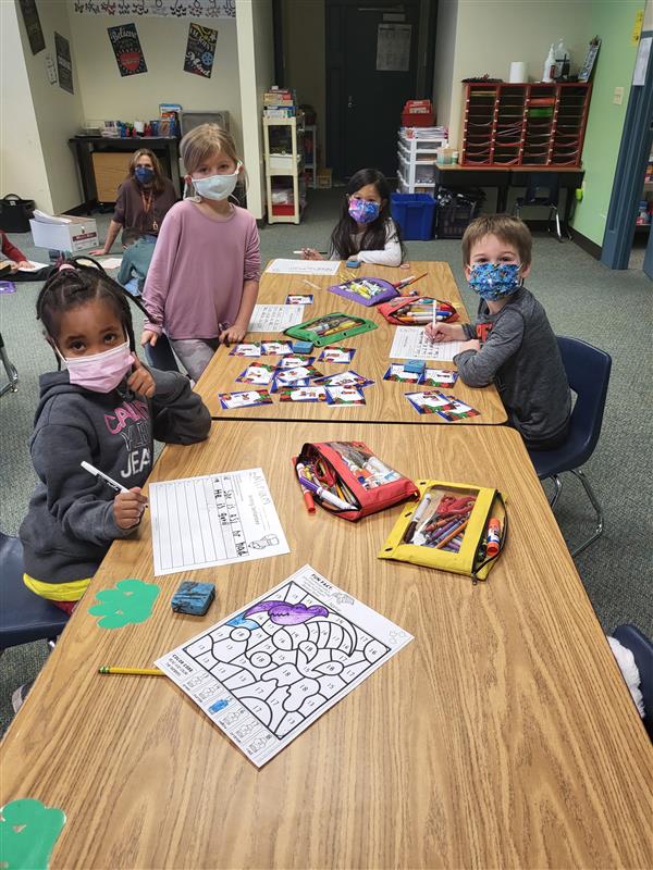 Mrs. Tellone's kindergarten class in in small groups for ELA