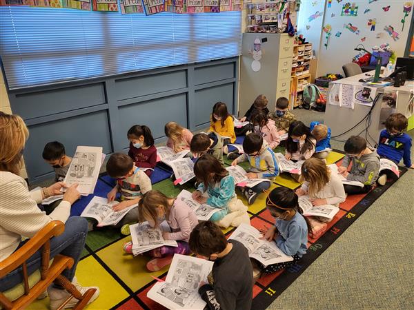 Mrs. Tellone's kindergarten class in in small groups for ELA