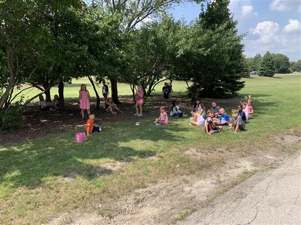 Mrs. Dhuse's 3rd grade class enjoying snack time outside