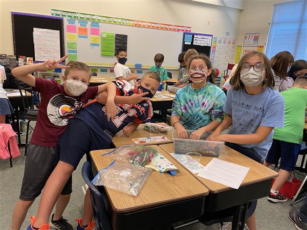 Miss Haupt's 5th graders creating terrariums for Science! 