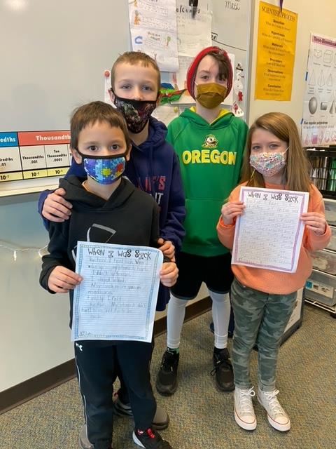 Students in Mrs. Brougham's1st grade read their writing to their sibling in Mrs. Niles' class.