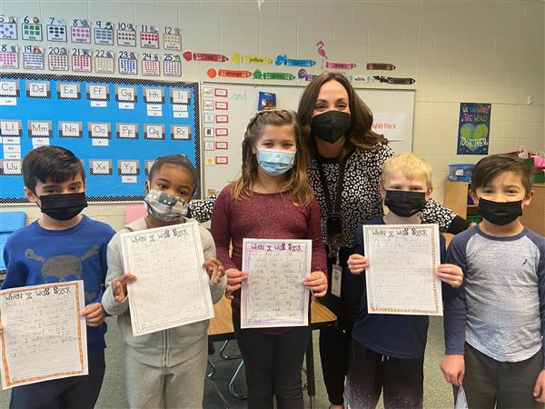 Mrs. Brougham's students sharing their writing with Mrs. McCoskey's kindergarten class.