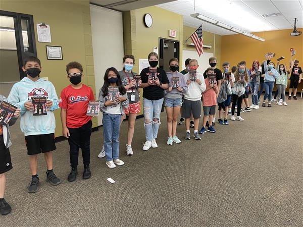 A long line of 6th graders waiting to get their books signed by author, Lindsay Currie.