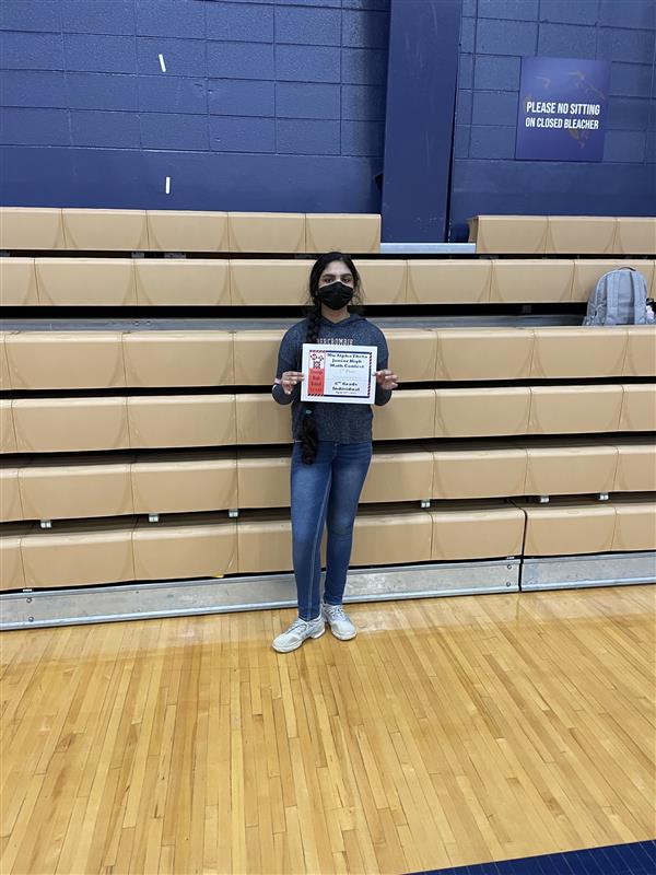 Shrihitha Ketha stands with certificate