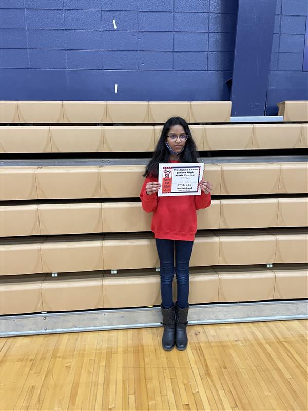 Shriya Rao stands with certificate