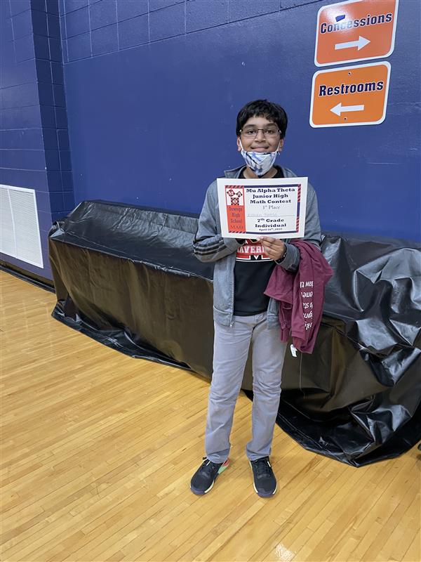 Kushan Bonela stands with certificate