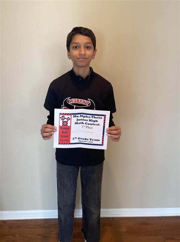 Daiwik poses with certificate