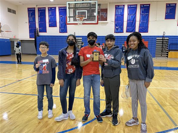 5 students pose with 1st place plaque