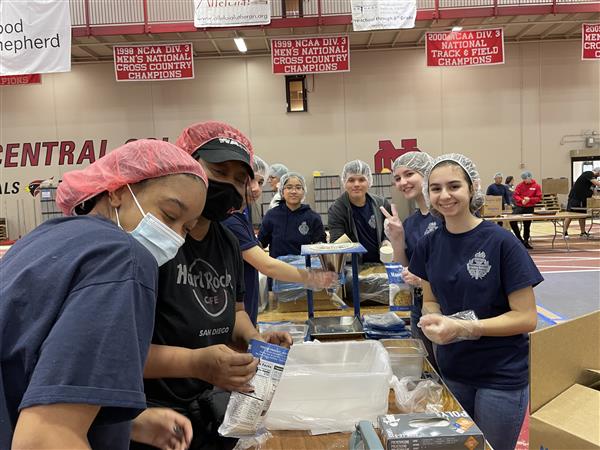 Several students pack up food