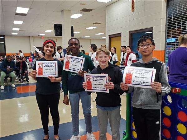 Students pose with certificates at math competition
