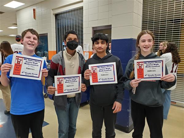 Students pose with certificates at math competition