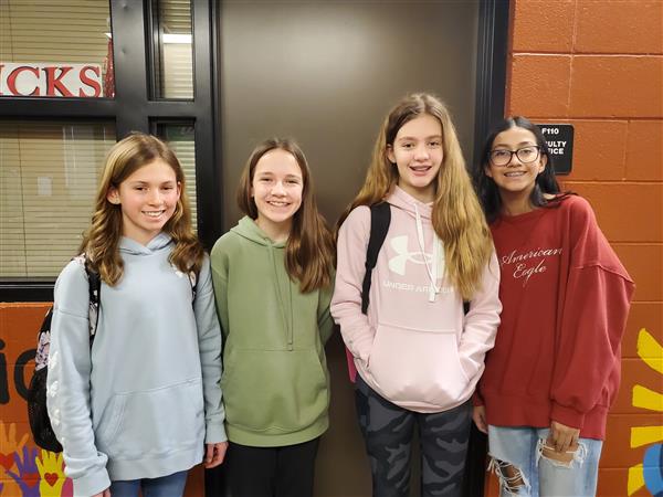 Students pose with certificates at math competition