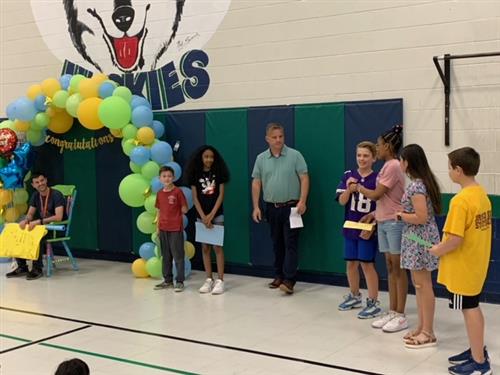 Students reading to Michael Leali