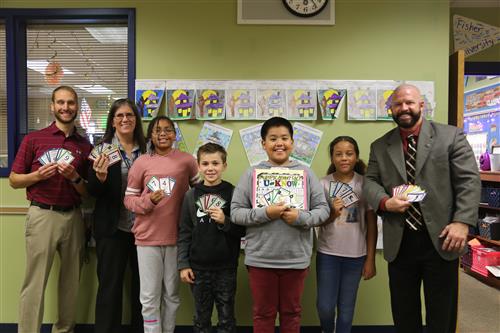 Dr. Sparlin and students playing U-Know