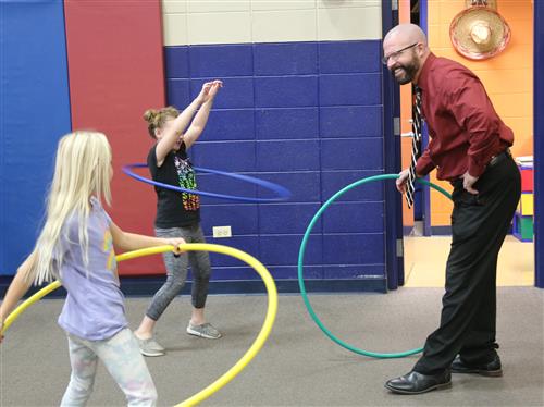 Dr. Sparlin and students with hula hoops