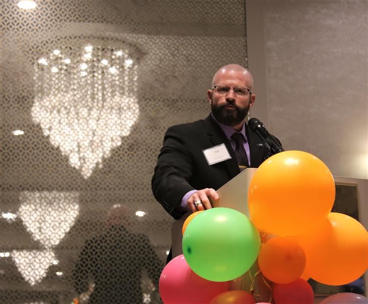 Dr. Sparlin at podium