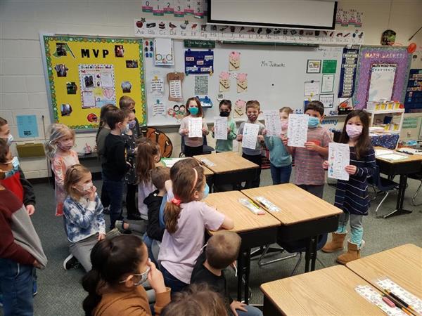 Mrs. Grauer's class sharing their writing with Ms. Gbur's class